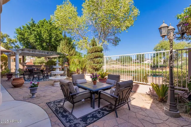 a view of a patio with couches and potted plants