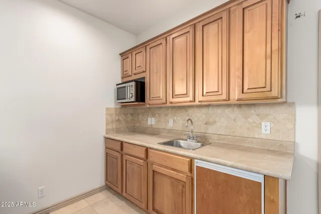 a view of a dining room with furniture and a potted plant