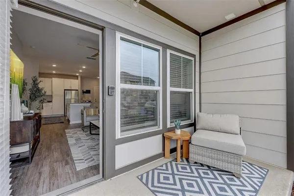 a front view of a residential apartment building with a yard