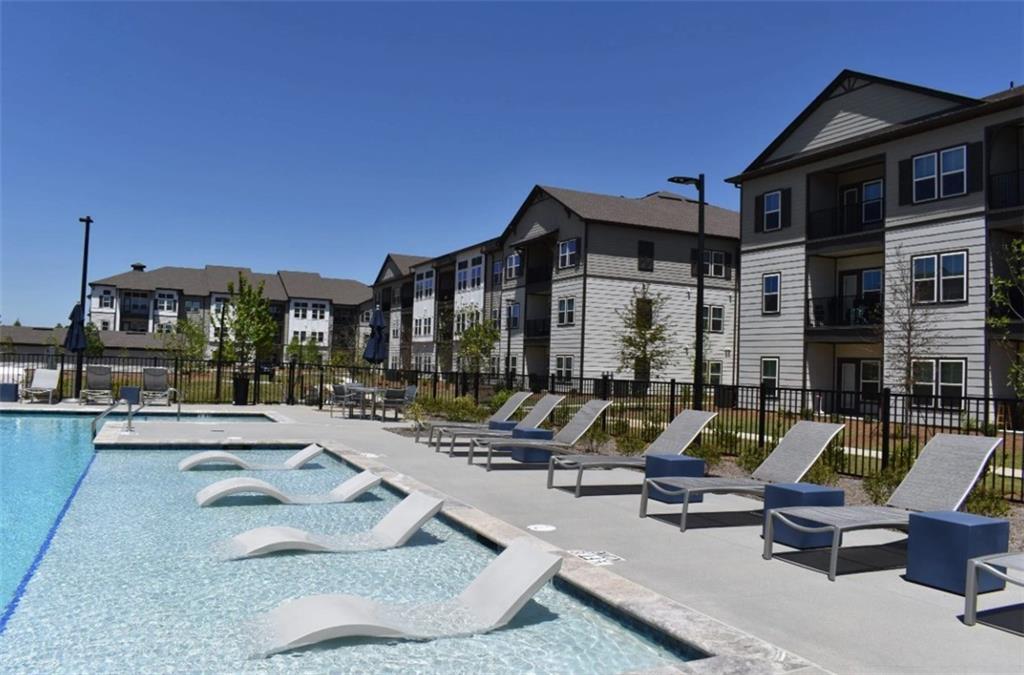 4000 Mill Spring Circle, Unit 4918 Oakwood, GA 30566 - Photo 15 of 28 a view of pool with outdoor seating