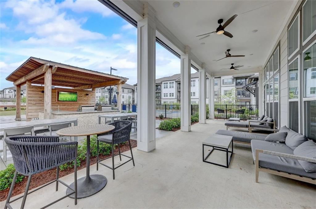 4000 Mill Spring Circle, Unit 4918 Oakwood, GA 30566 - Photo 18 of 28 a patio with patio table and chairs