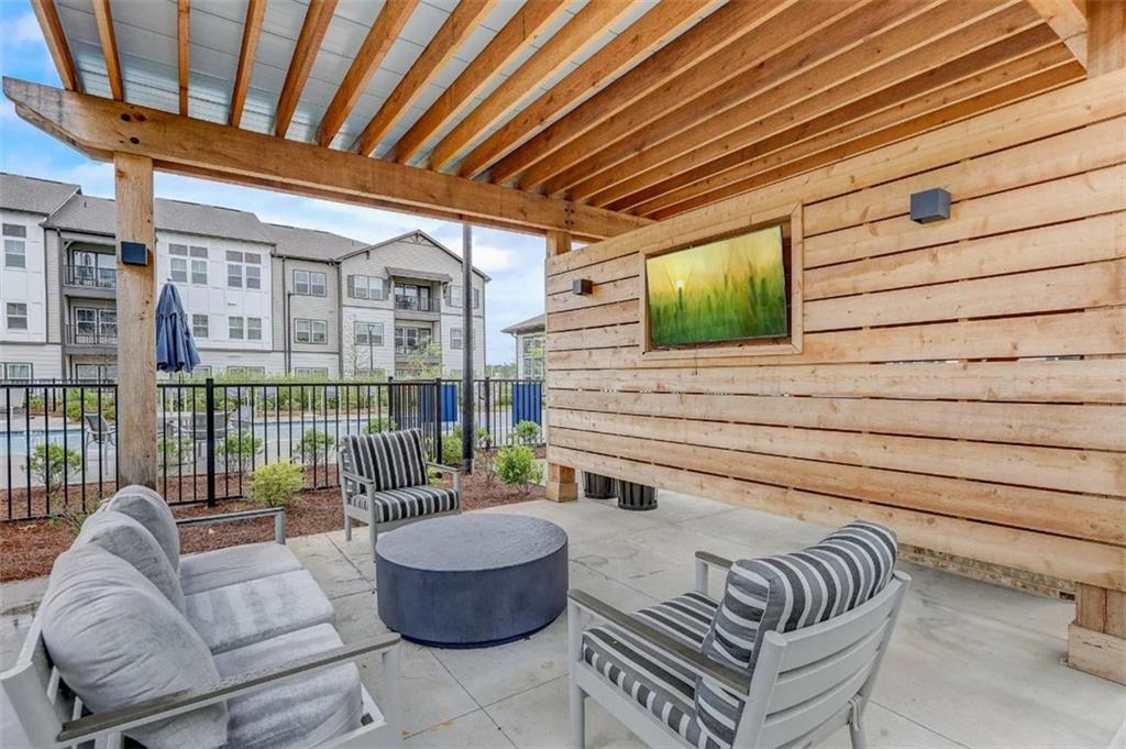 4000 Mill Spring Circle, Unit 4918 Oakwood, GA 30566 - Photo 19 of 28 a balcony with furniture and a potted plant