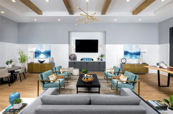 a view of a livingroom with furniture and an empty room