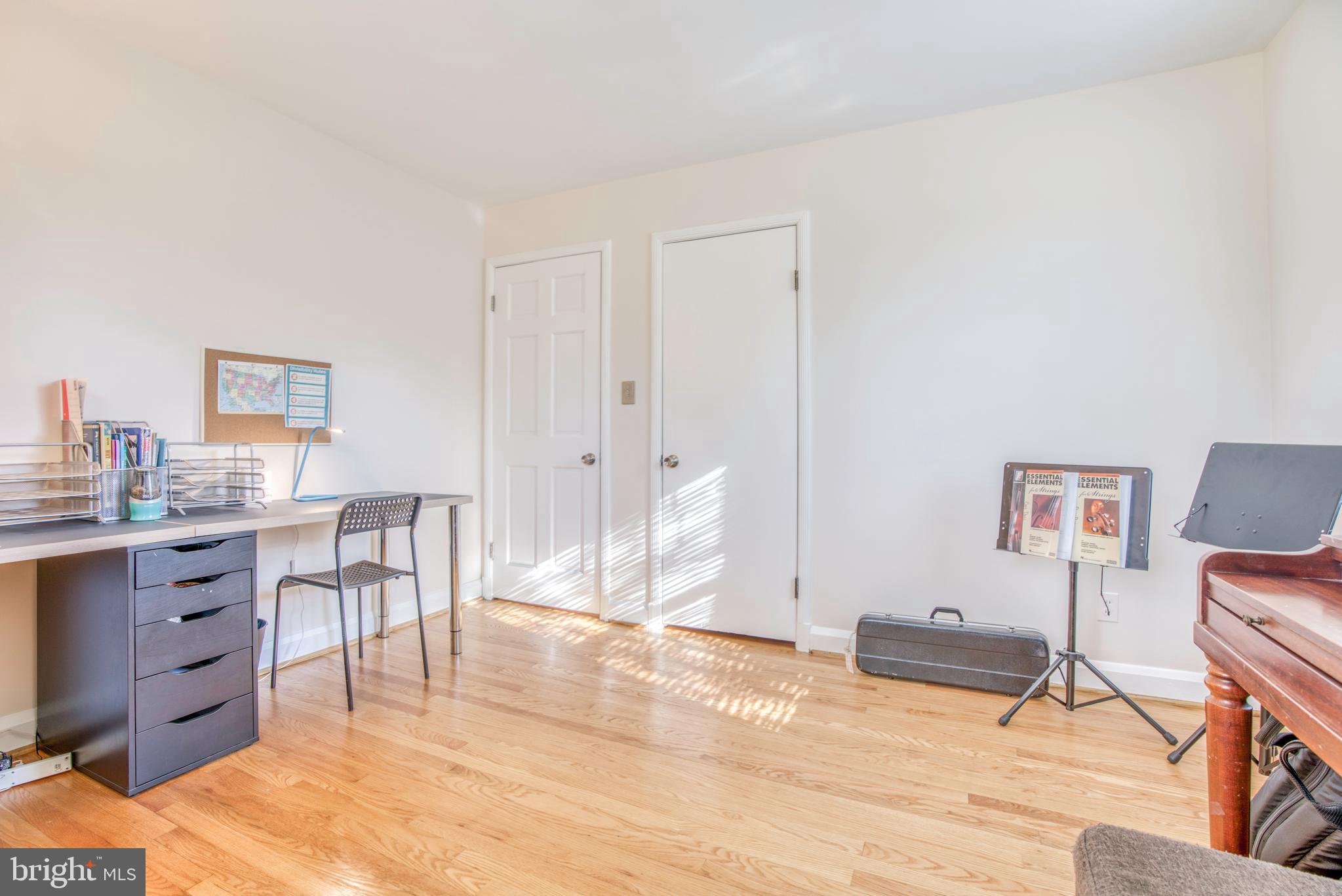 1305 Glendale Road Baltimore, MD 21239 - Photo 16 of 49 a view of a workspace with furniture and a window