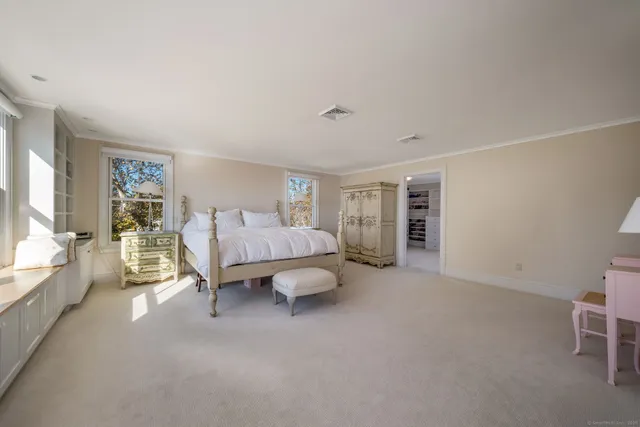a bathroom with a granite countertop sink vanity and mirror