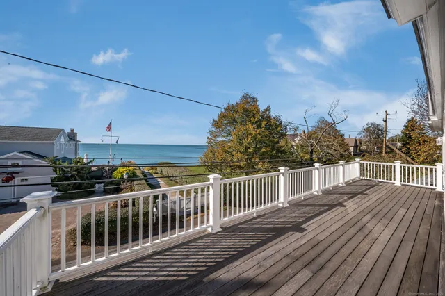 a bathroom with a double vanity sink window and mirror