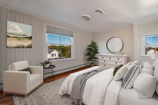 a view of a living room area with furniture and window