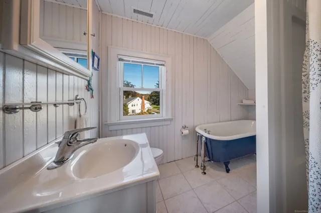 a work room with furniture and a window