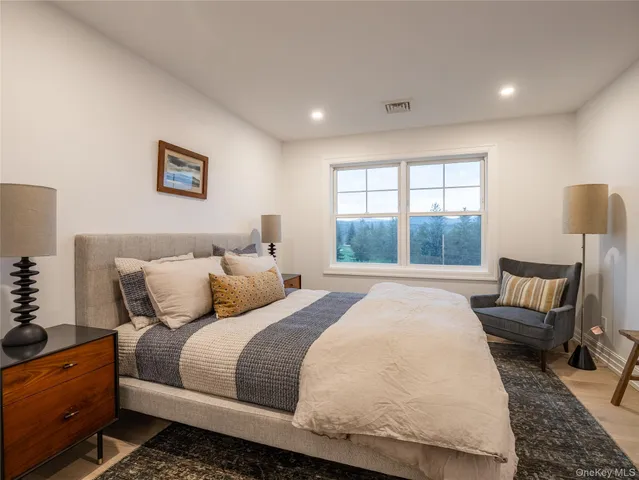 a bathroom with double sink and a mirror