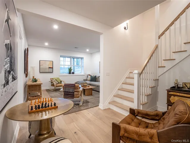 a spacious bedroom with a bed and a window