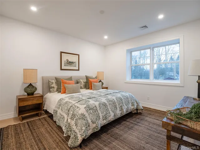 a living room with furniture and a dining table