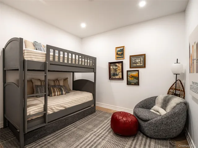 a bathroom with a shower a toilet and a sink