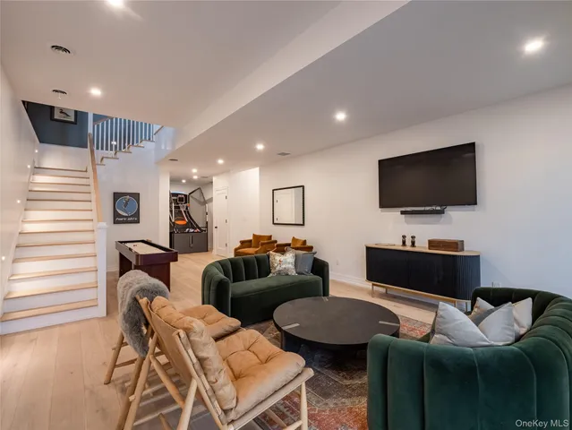 a room with furniture and flat screen tv