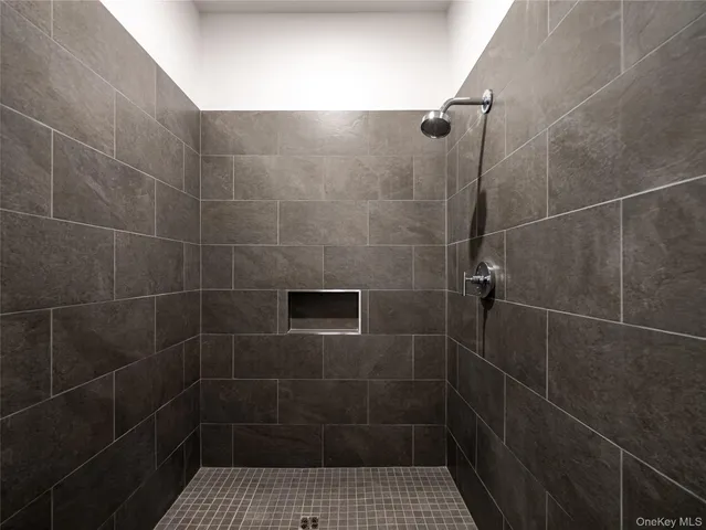 a view of a room with gym equipment and a large window