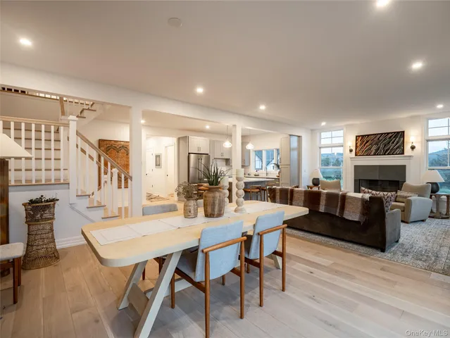 a dining room with furniture and wooden floor