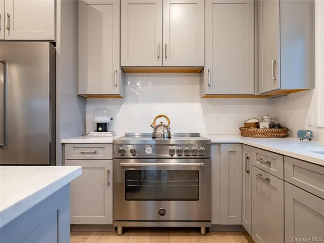 a large kitchen with a table and chairs