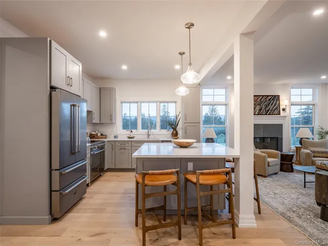a stove top oven sitting inside of a kitchen
