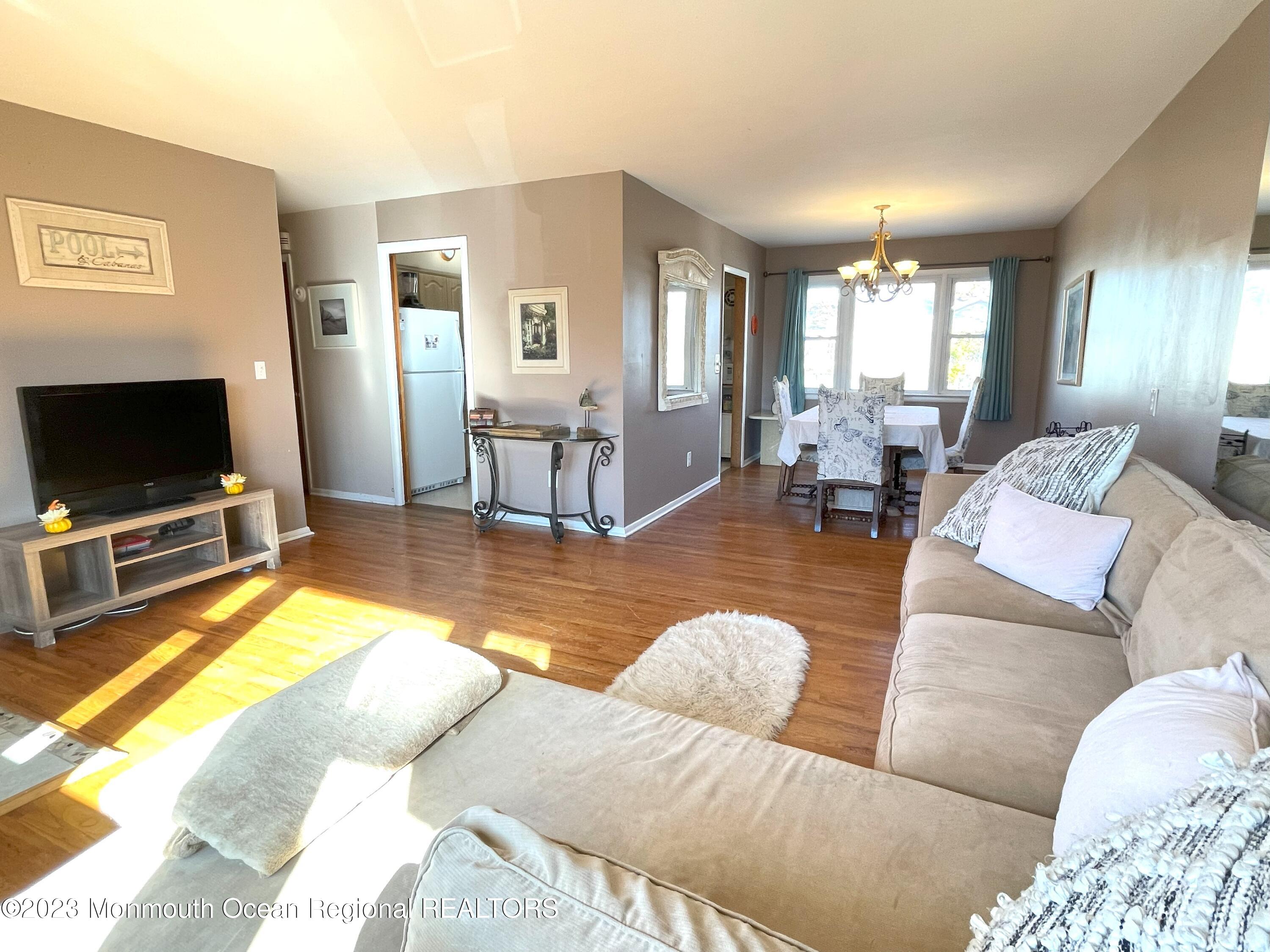 309 Midstreams Road Brick, NJ 08724 - Photo 4 of 26 a living room with furniture and a flat screen tv