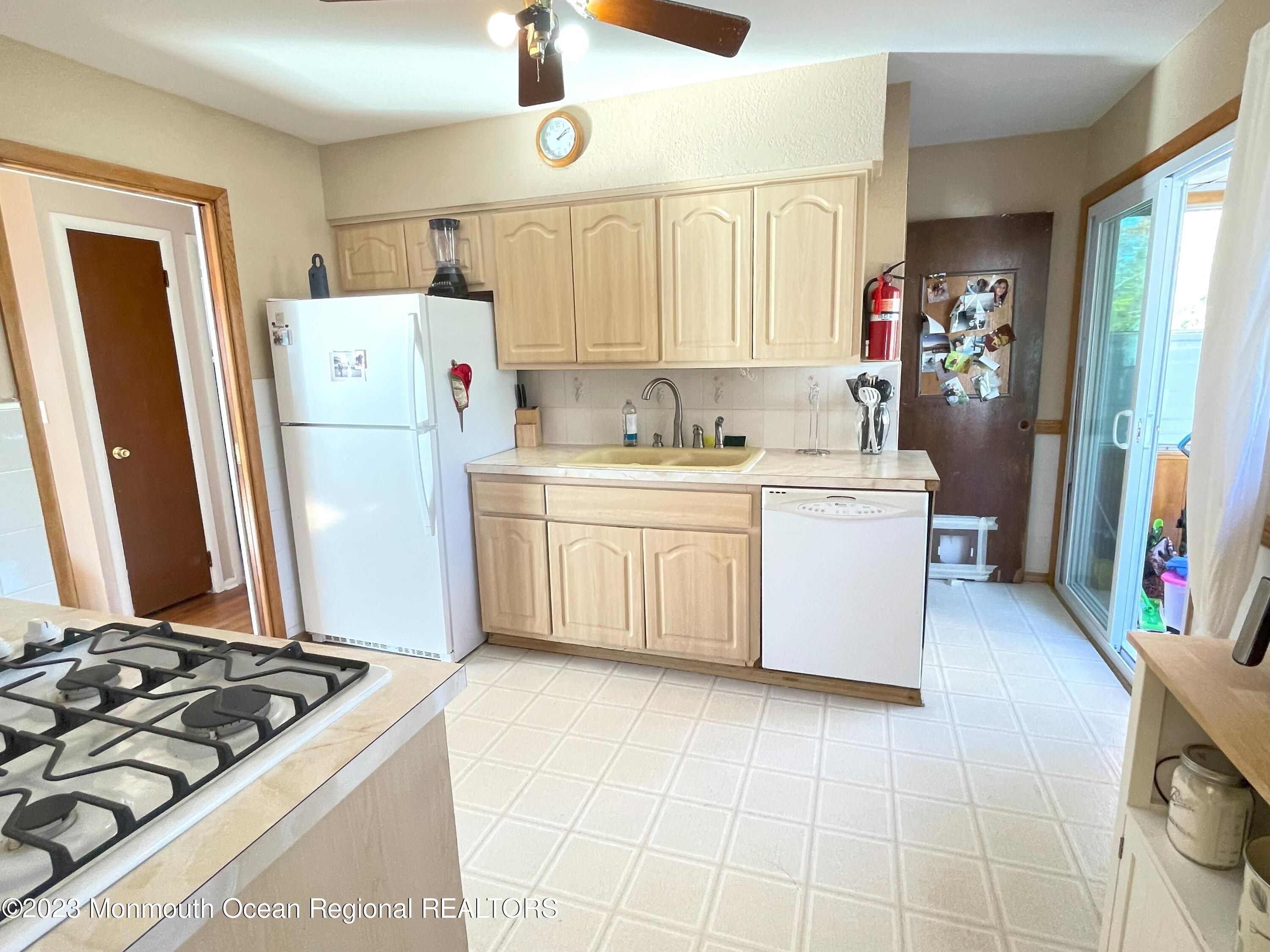 309 Midstreams Road Brick, NJ 08724 - Photo 10 of 26 a kitchen with a stove and a refrigerator