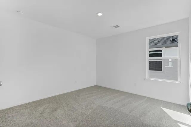 a view of empty room with windows