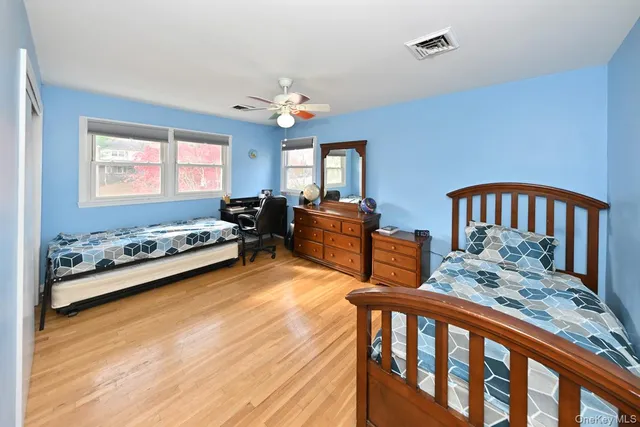 a bedroom with furniture and a window