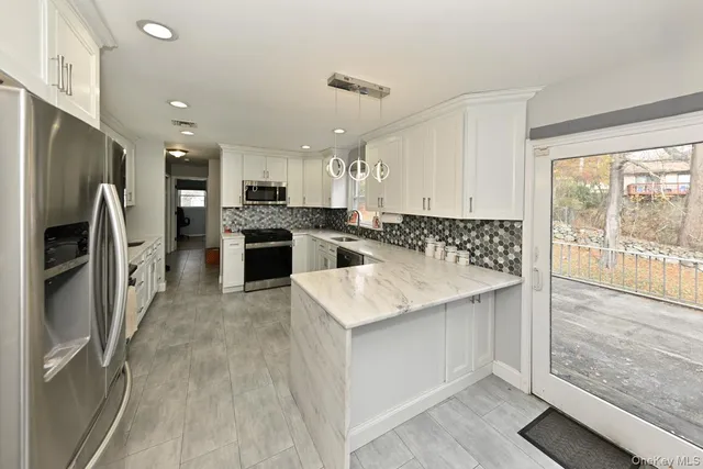 a kitchen with a sink stove and refrigerator