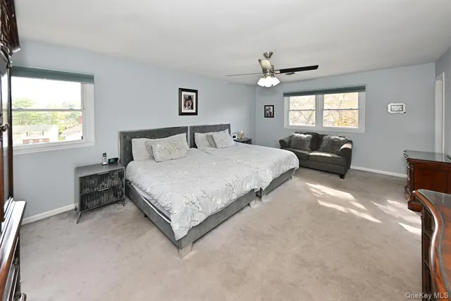 a bedroom with bed and a chandelier