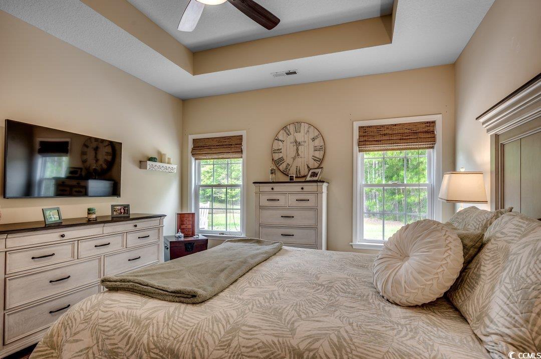 196 Rose Water Loop Myrtle Beach, SC 29588 - Photo 17 of 24 Bedroom with visible vents, multiple windows, and