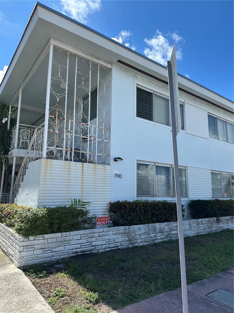 790 81st Street, Unit 3 Miami Beach, FL 33141 - Photo 1 of 10 a front view of a house with balcony