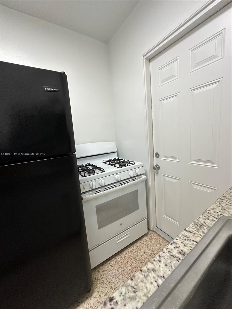 790 81st Street, Unit 3 Miami Beach, FL 33141 - Photo 6 of 10 a view of washer and dryer