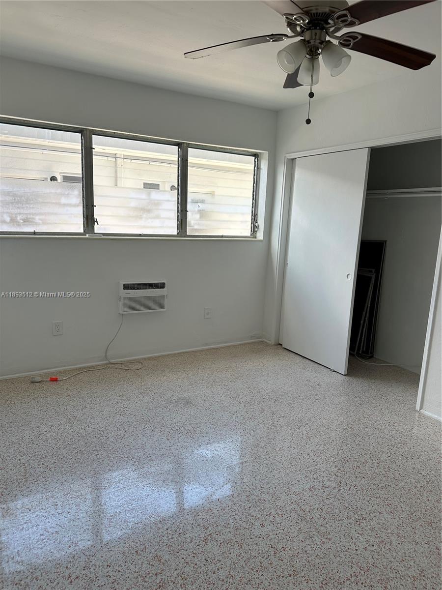 790 81st Street, Unit 3 Miami Beach, FL 33141 - Photo 10 of 10 an empty room with windows