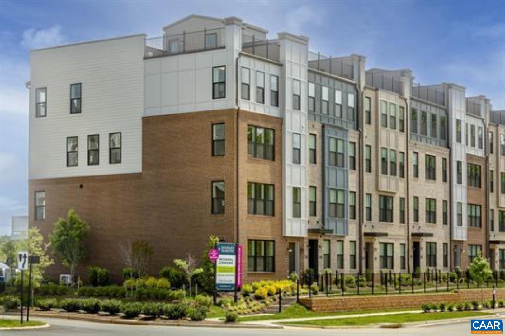 828 A Wesley Lane, Unit A Charlottesville, VA 22911 - Photo 1 of 33 a front view of a building with a yard and plants