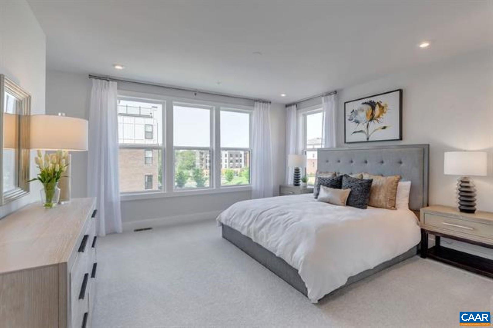 828 A Wesley Lane, Unit A Charlottesville, VA 22911 - Photo 19 of 33 a bedroom with a large bed and a window