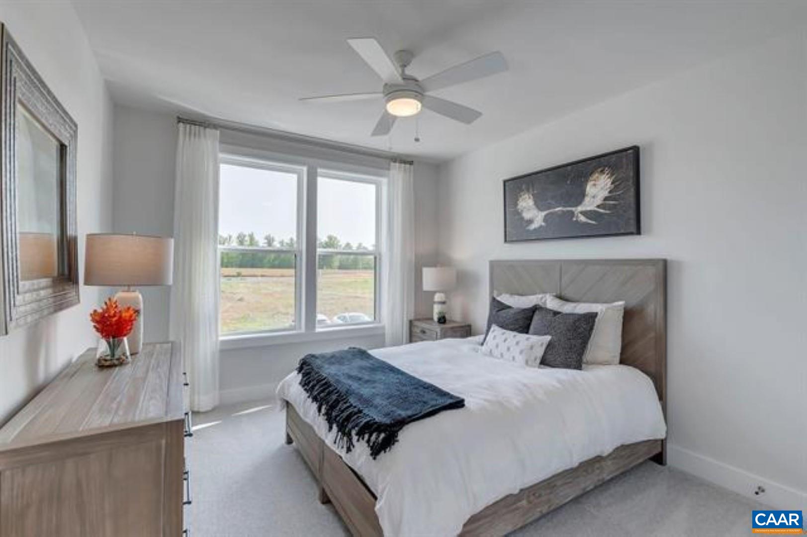 828 A Wesley Lane, Unit A Charlottesville, VA 22911 - Photo 24 of 33 a bedroom with a bed and window