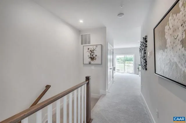 a view of a hallway with a window