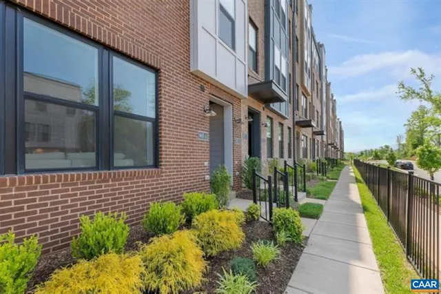 a view of a pathway both side of house