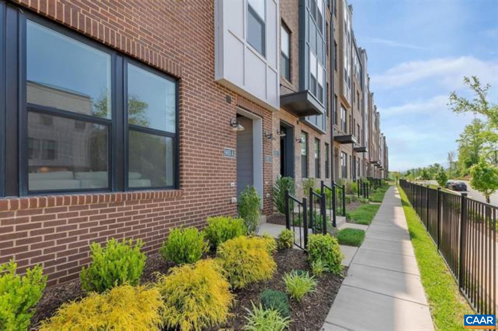 828 A Wesley Lane, Unit A Charlottesville, VA 22911 - Photo 3 of 33 a view of a pathway both side of house