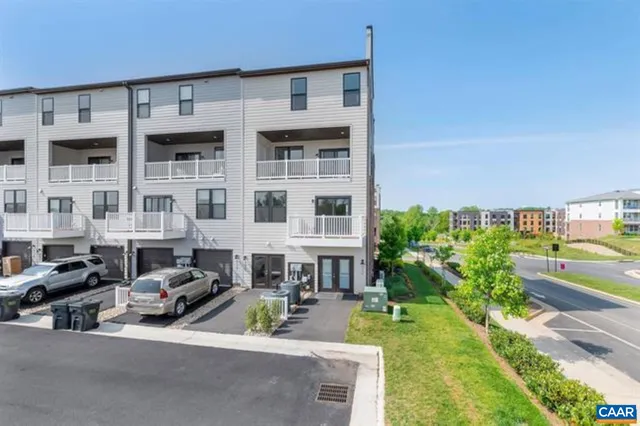 a view of multiple house with a yard