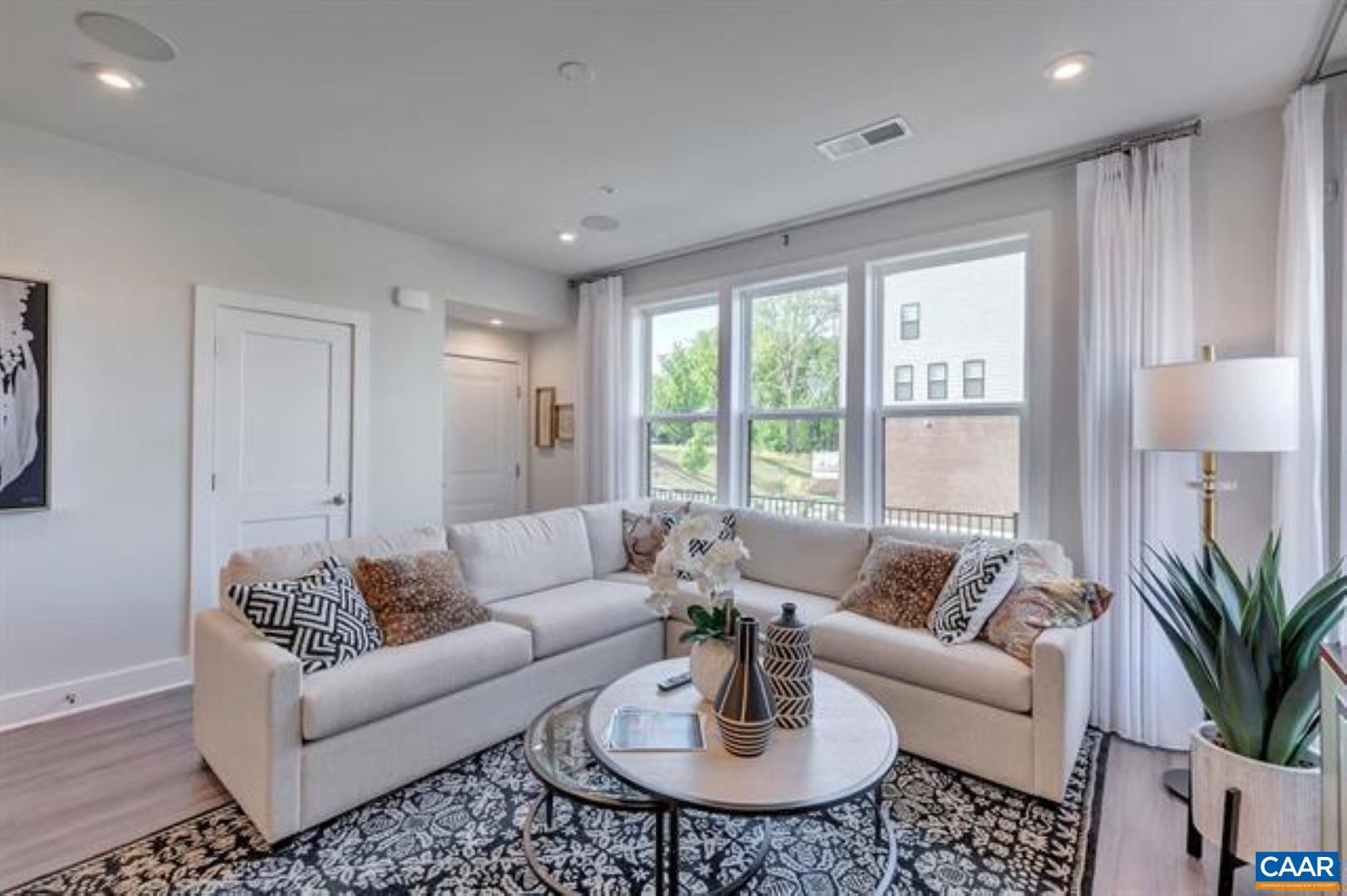 828 A Wesley Lane, Unit A Charlottesville, VA 22911 - Photo 8 of 33 a living room with furniture and a large window
