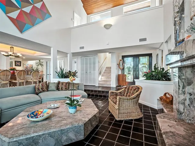 a view of a dining room with furniture and chandelier