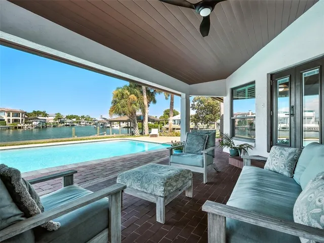 a view of a house with yard and sitting area