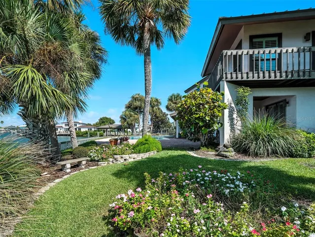 a spacious bathroom with a granite countertop sink a mirror and a bathtub