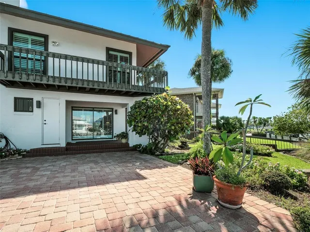 a bathroom with a granite countertop sink mirror and bathtub