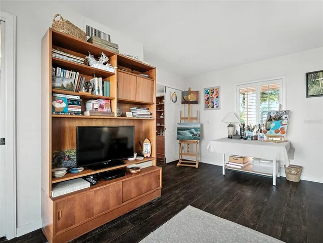 a spacious bedroom with a bed and window