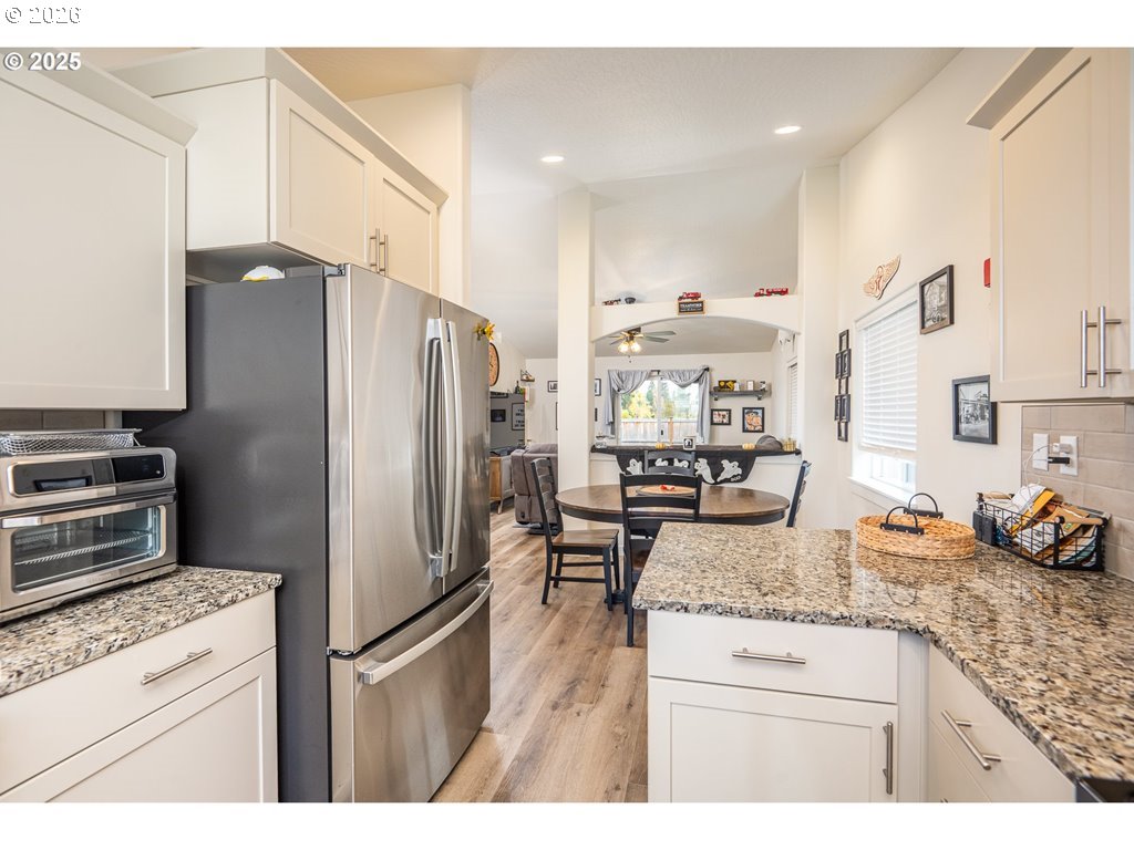 4967 Cedar View Drive Springfield, OR 97478 - Photo 6 of 22 a kitchen with stainless steel appliances granite countertop a refrigerator a stove and a sink