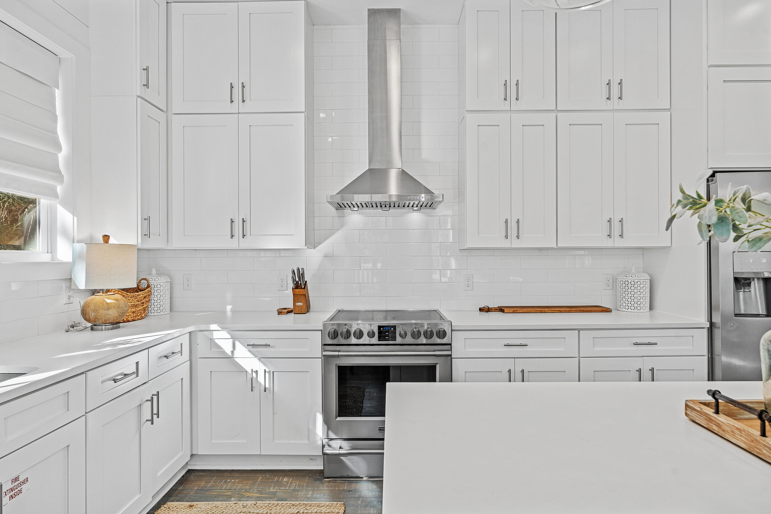 17 Pompano Court Inlet Beach, FL 32461 - Photo 17 of 48 a kitchen with granite countertop white cabinets and white appliances