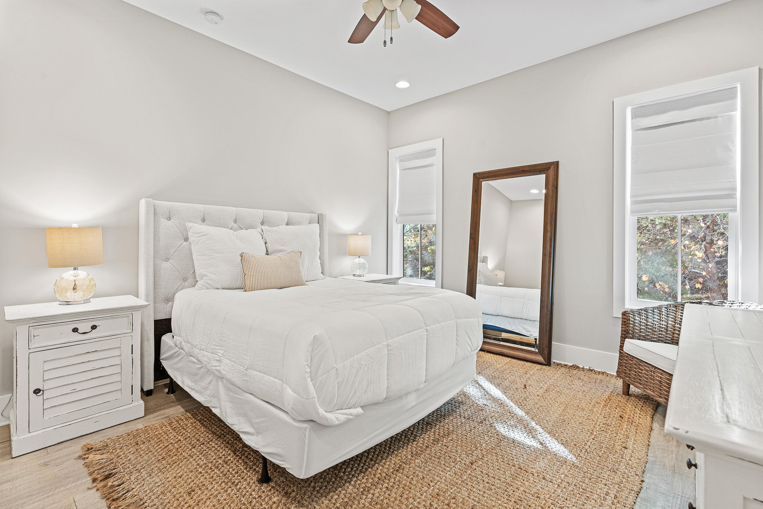 17 Pompano Court Inlet Beach, FL 32461 - Photo 26 of 48 a bedroom with a large bed and a chandelier