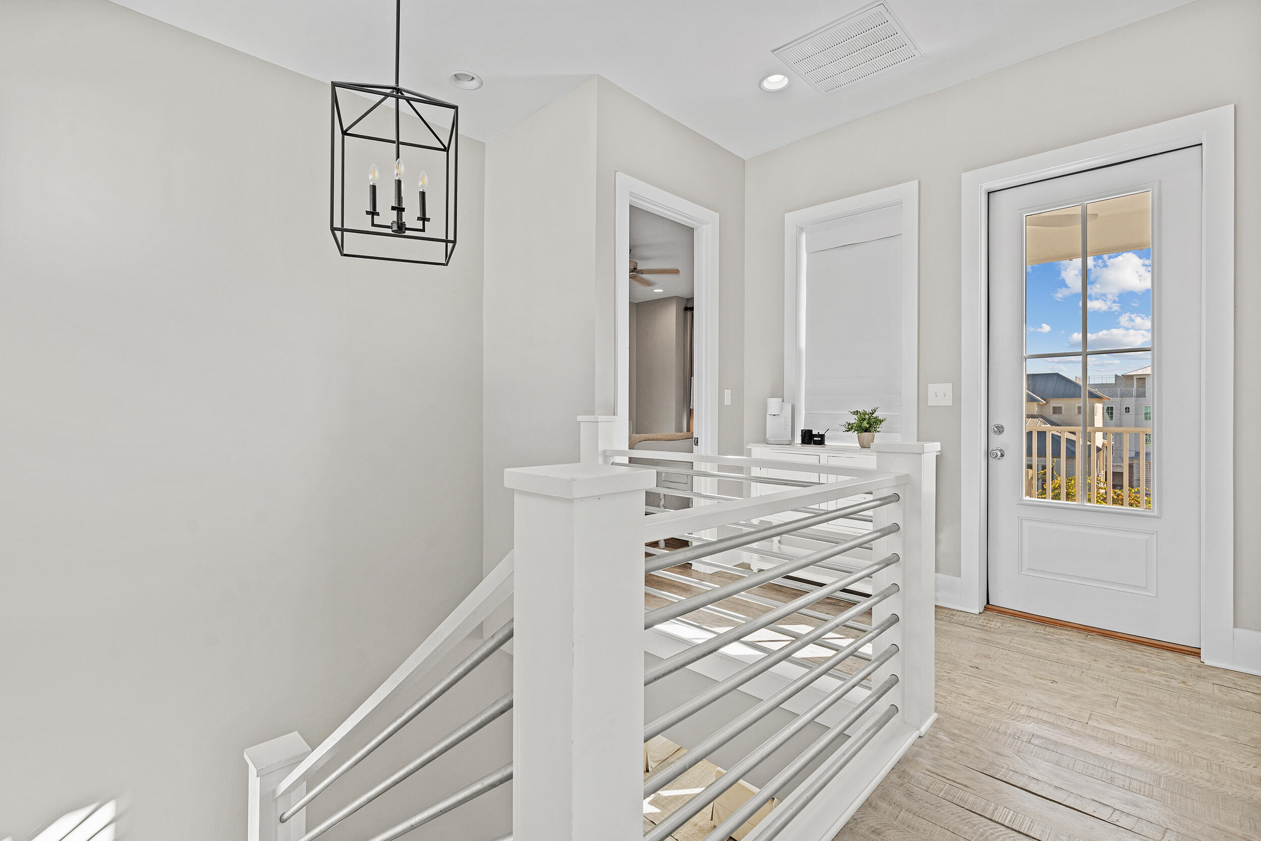 17 Pompano Court Inlet Beach, FL 32461 - Photo 34 of 48 a view of a hallway with wooden floor and staircase