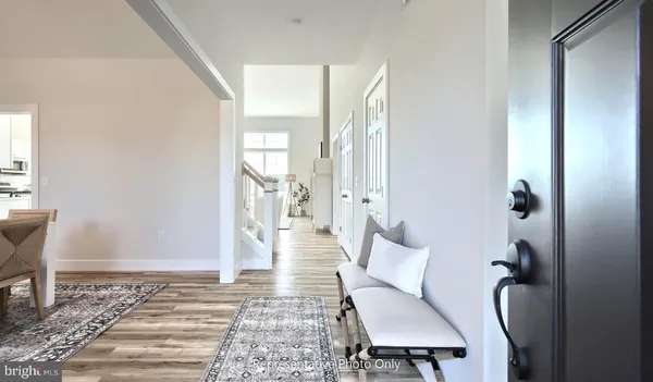 a living room with furniture and a rug