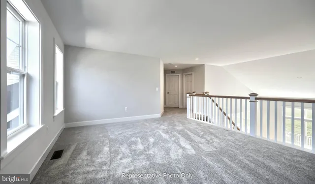 a view of an empty room and a window